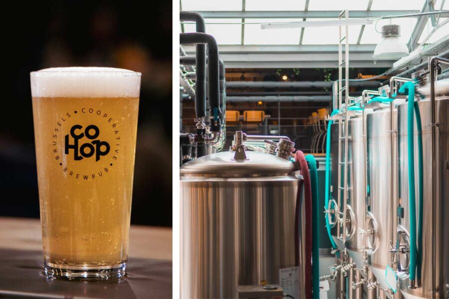 a freshly poured beer set on a table next to the brewhouse tanks